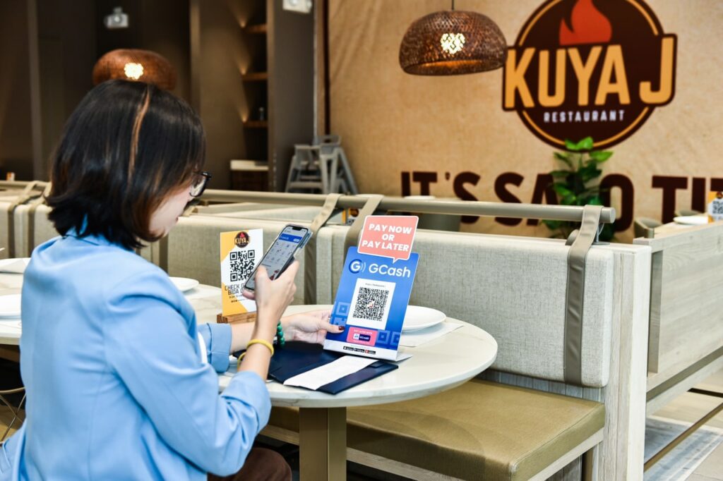 Customer paying at Kuya J Restaurant with GCash